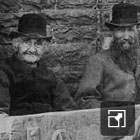 Locals in the stocks. © Old Gelligaer in Photographs by Maldwyn Griffiths & Richard Herold.